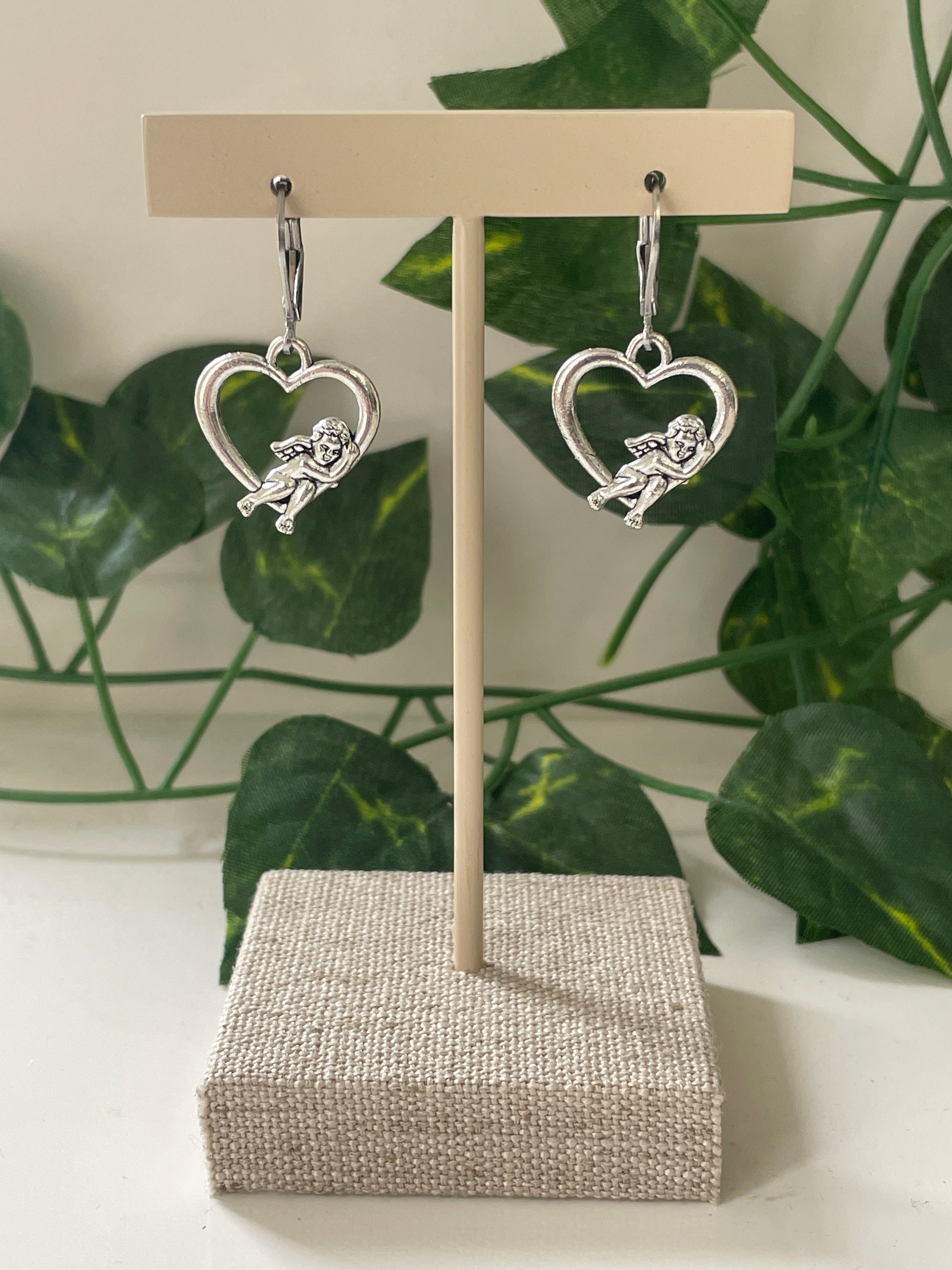 Silver Plated Cupid Laying On Heart Earrings