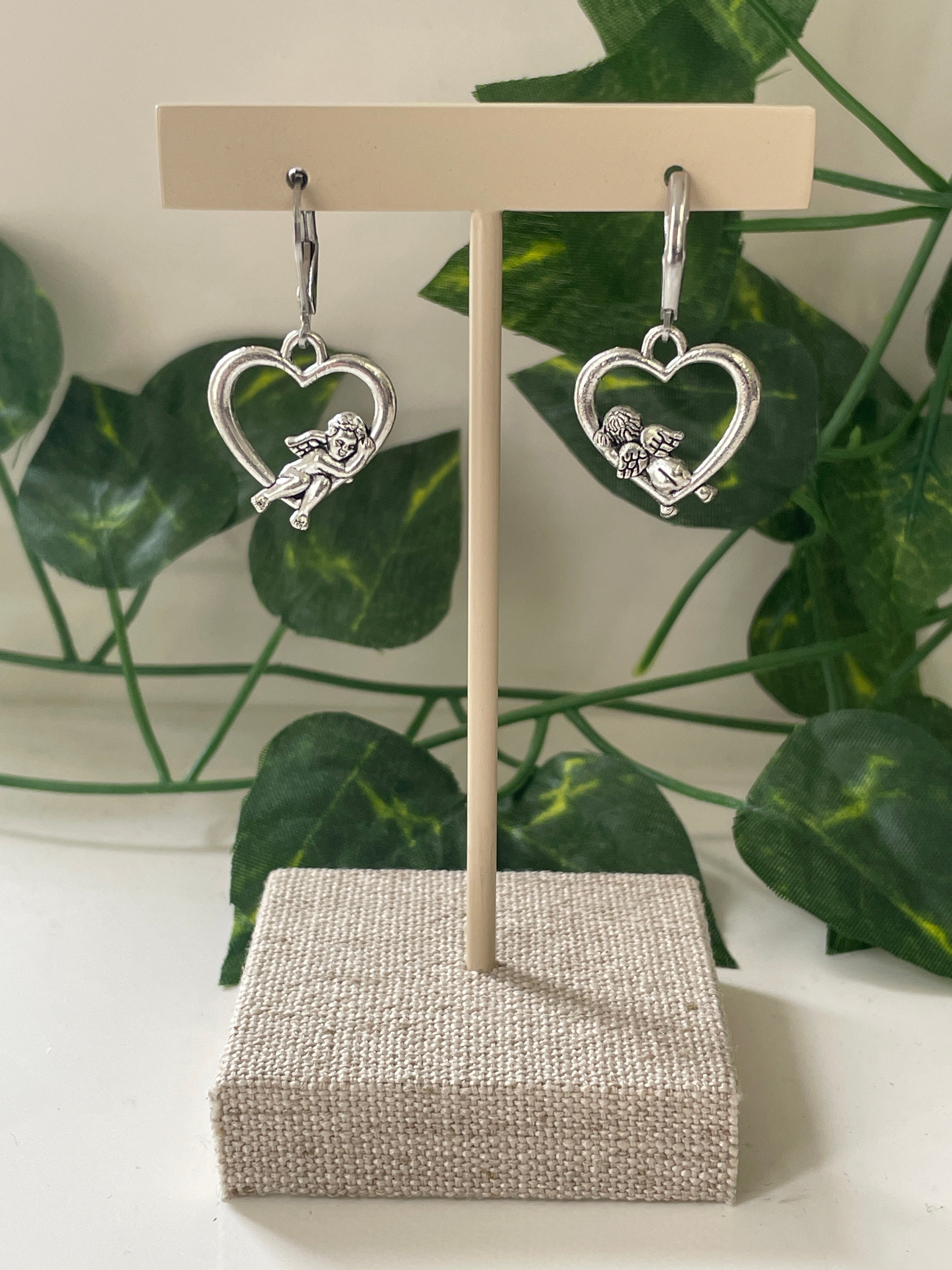 Silver Plated Cupid Laying On Heart Earrings